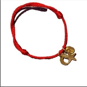 NWOT Jewa red cord with golden moon and star charms bracelet.